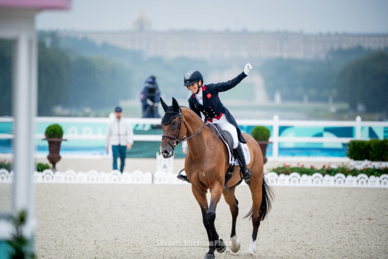 Laura Collett (GBR) celebrates after a record-breaking dressage test with London 52.